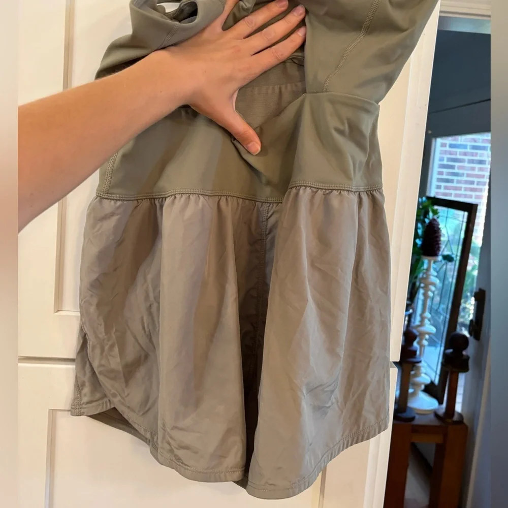 new Free People righteous runsie active romper in sage stone green